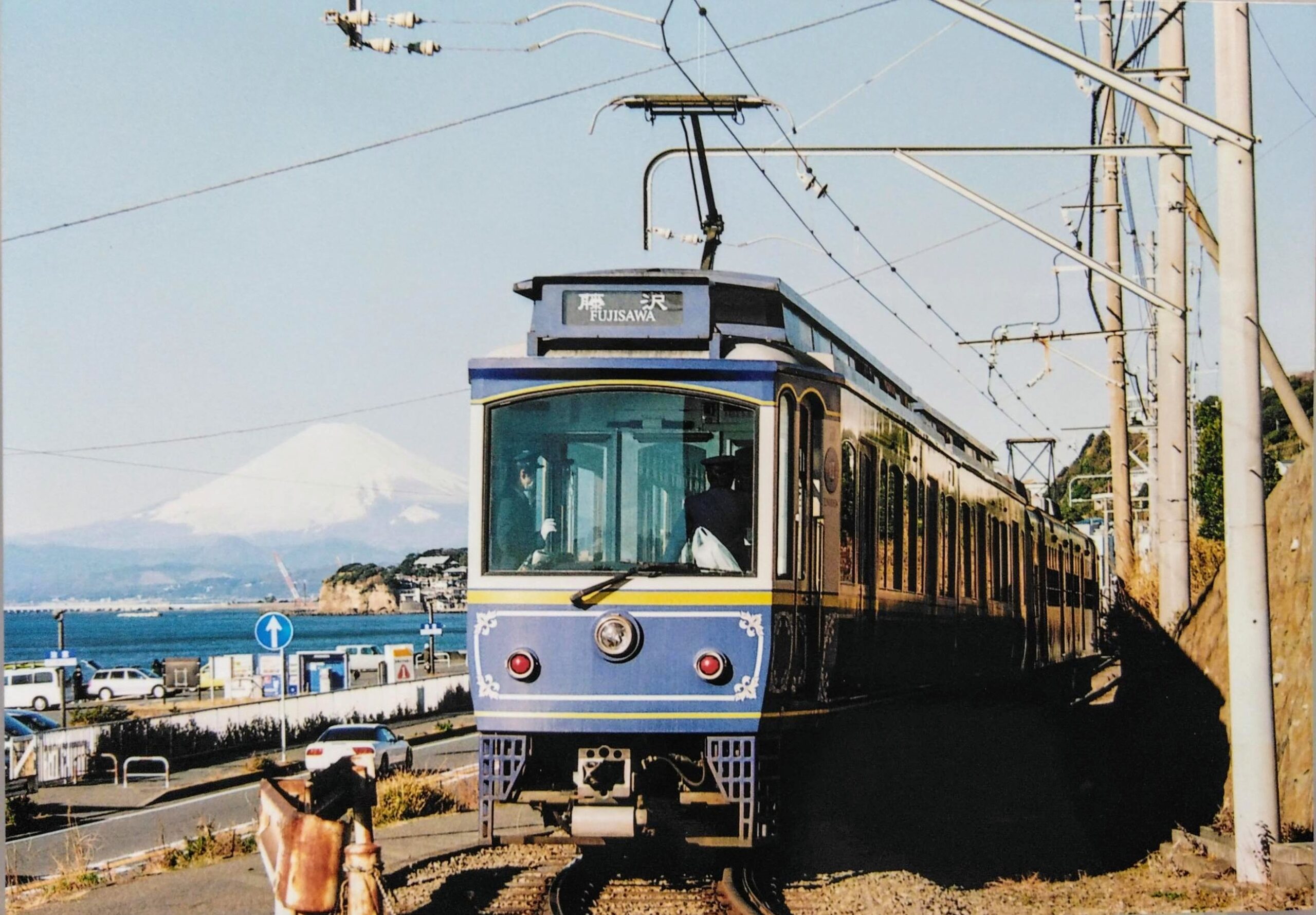 Enoden train beside the Shonan coast with Mount Fuji in the distance