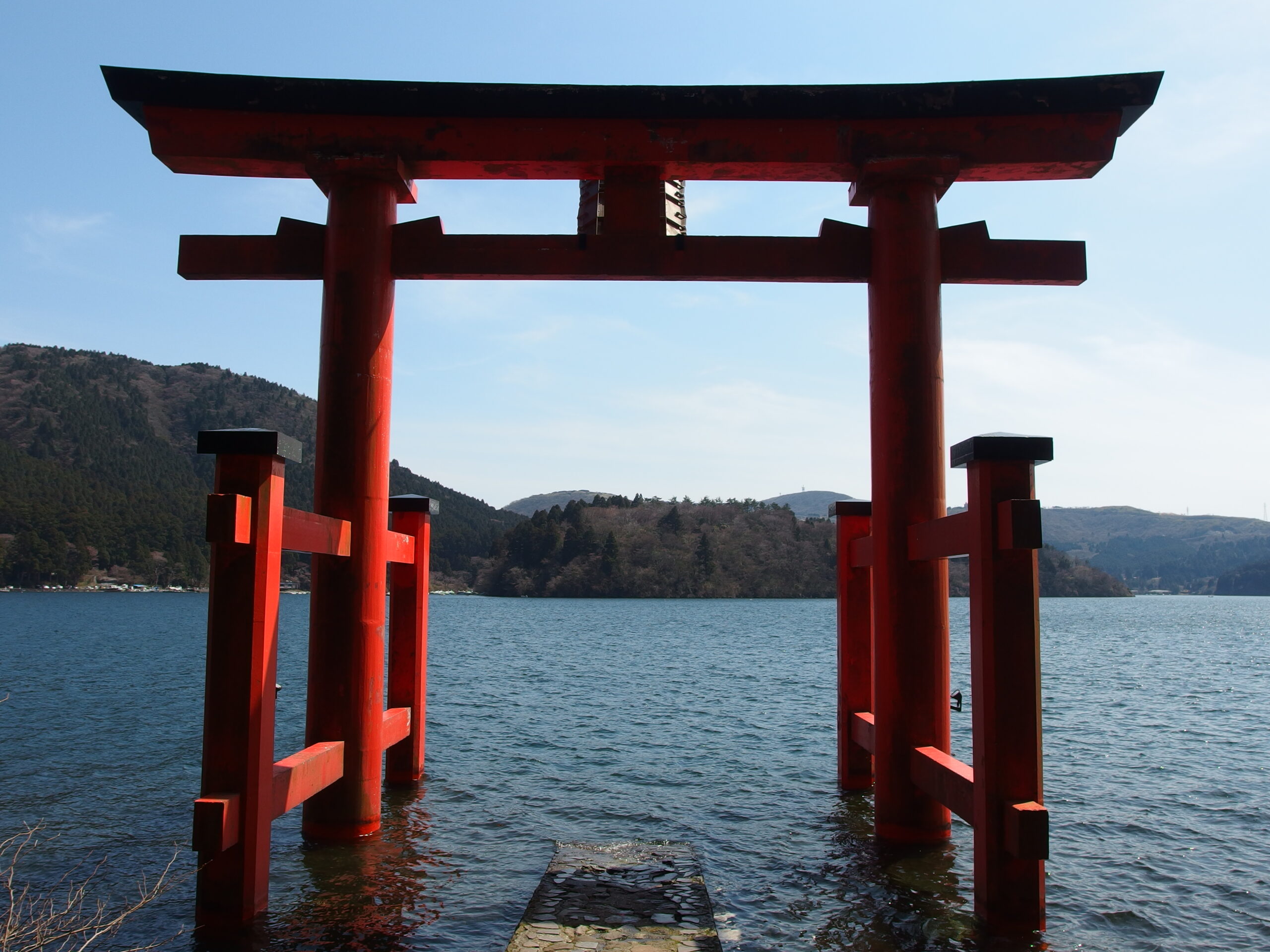 Vermilion Heiwa no Torii of Hakone Shrine standing at the edge of Lake Ashi