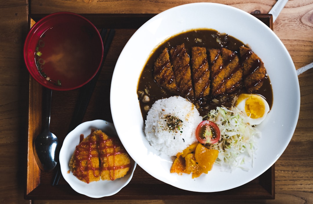Illustrative Japanese curry rice with cutlet and egg