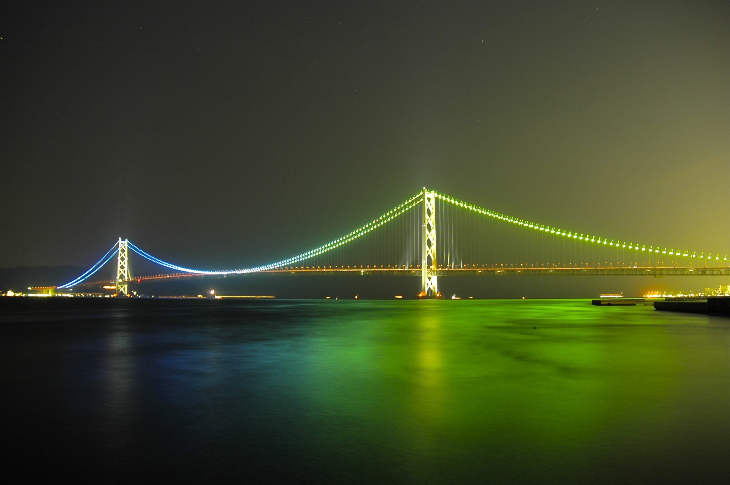 Akashi Kaikyo Bridge illuminated at night between Kobe and Awaji Island