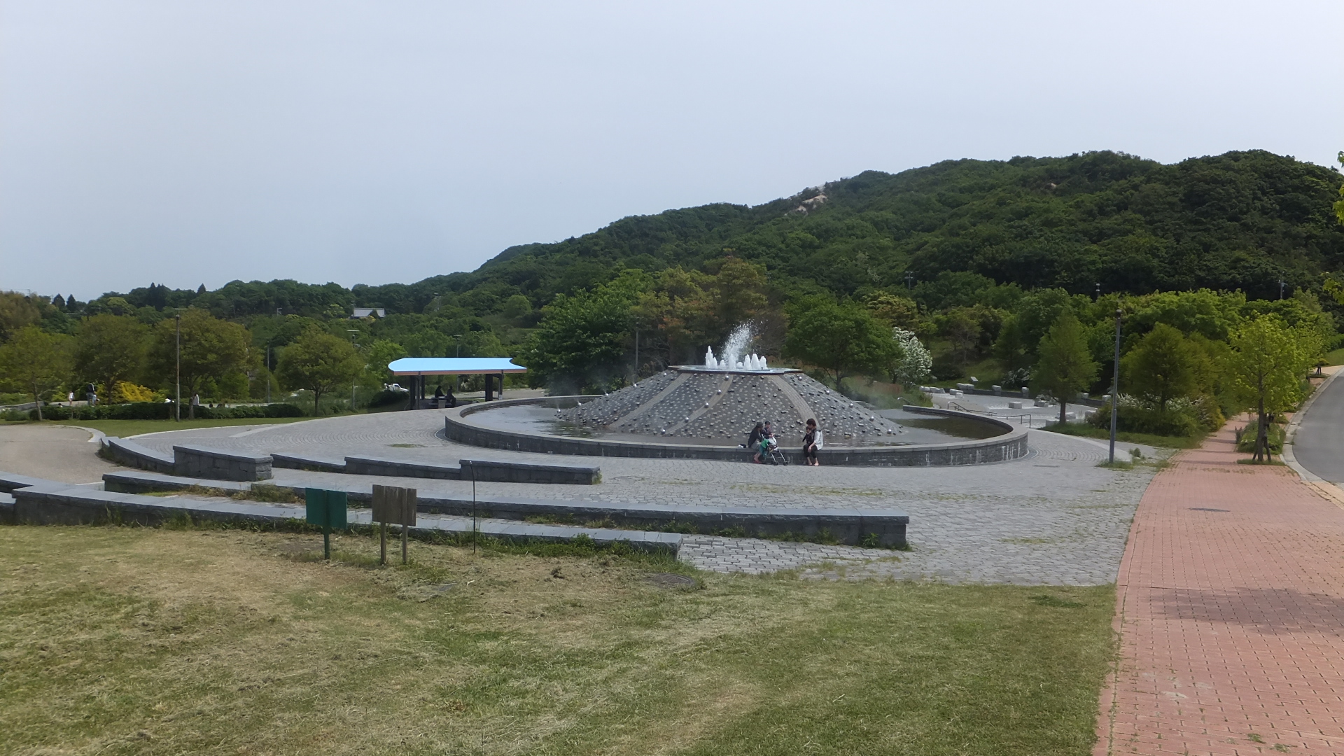 A fountain and paved paths in Awajishima Park