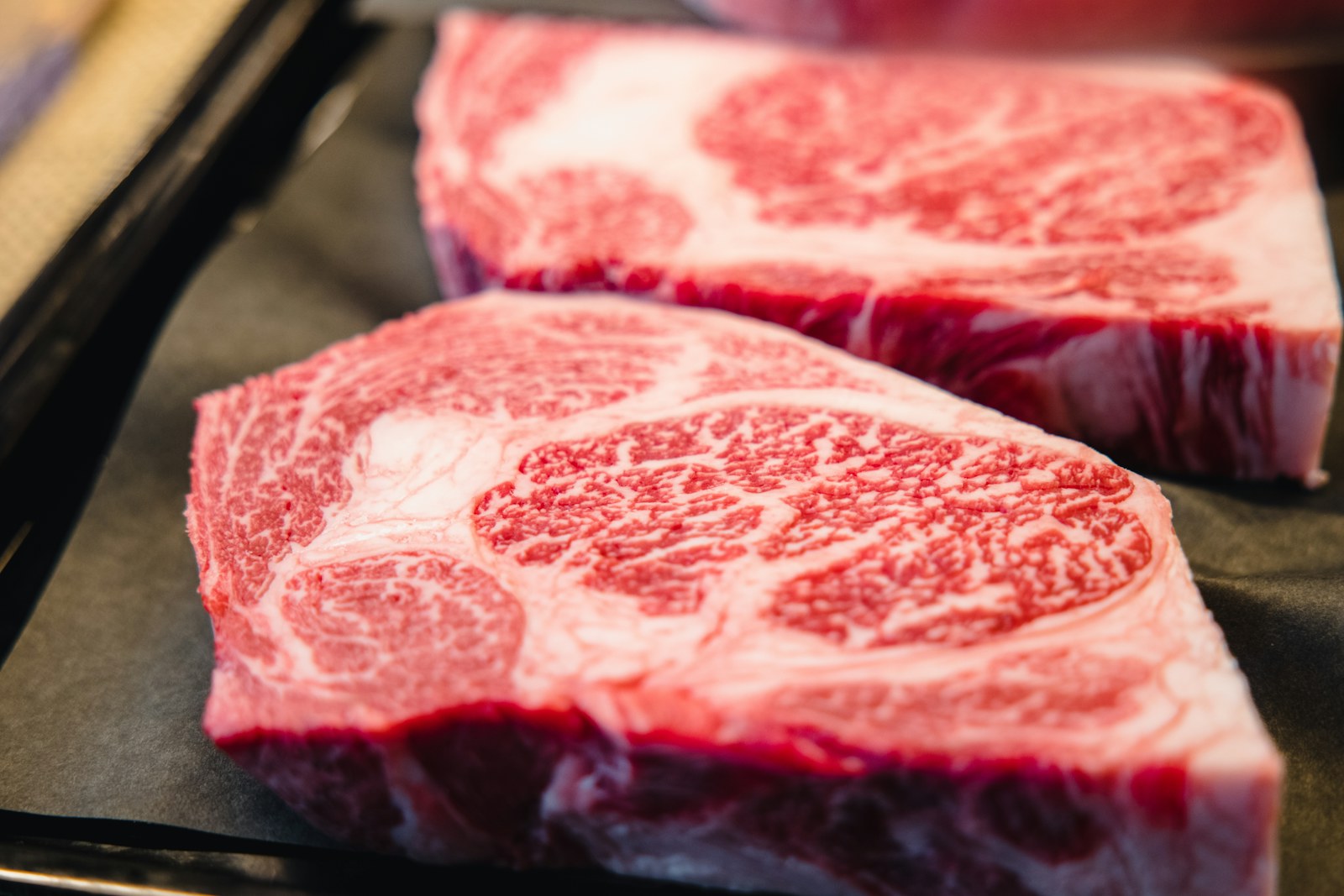 Japanese beef served on a dark plate
